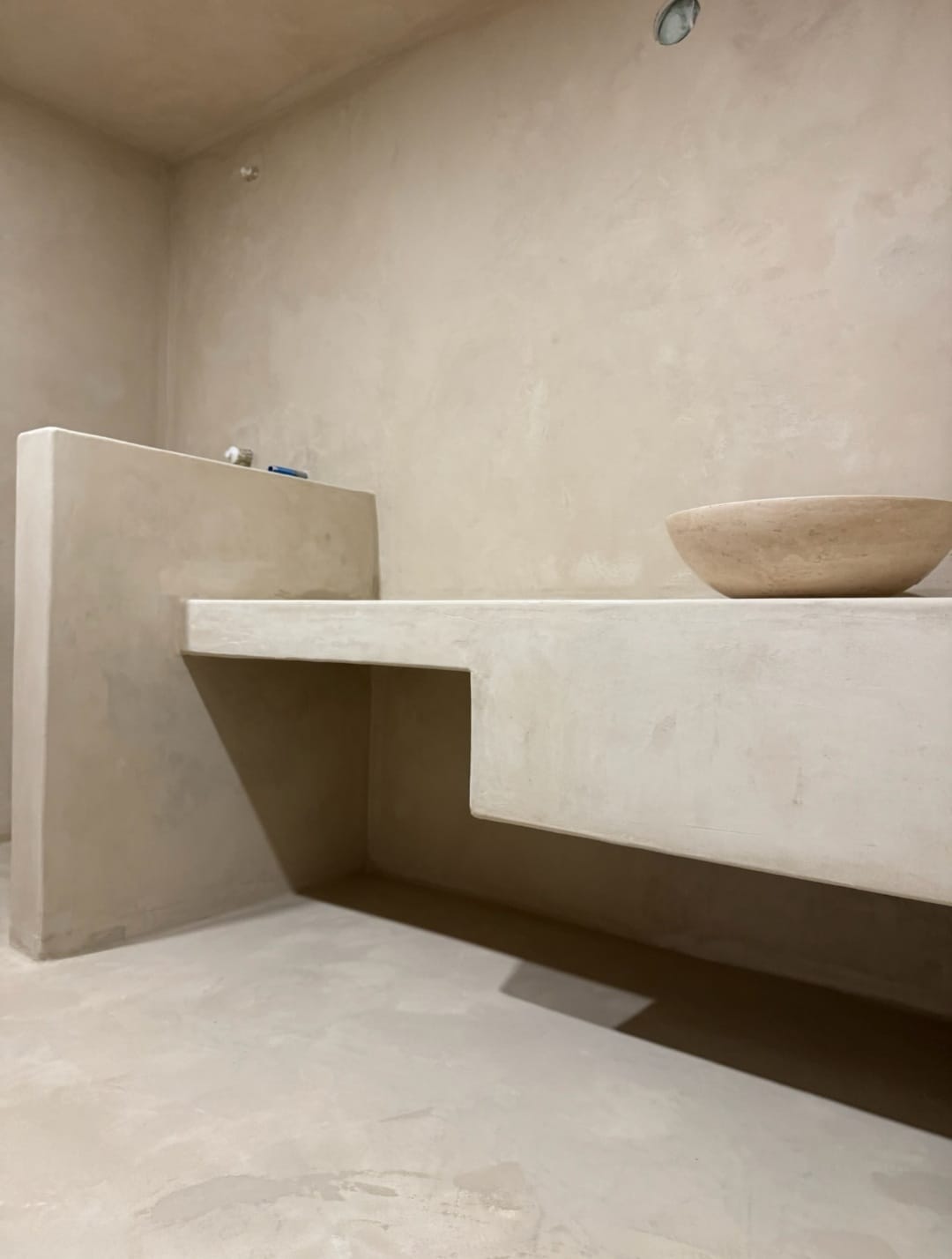 Beige microcement bathroom vanity with seamless walls by Boston Strong Plastering, North Shore MA